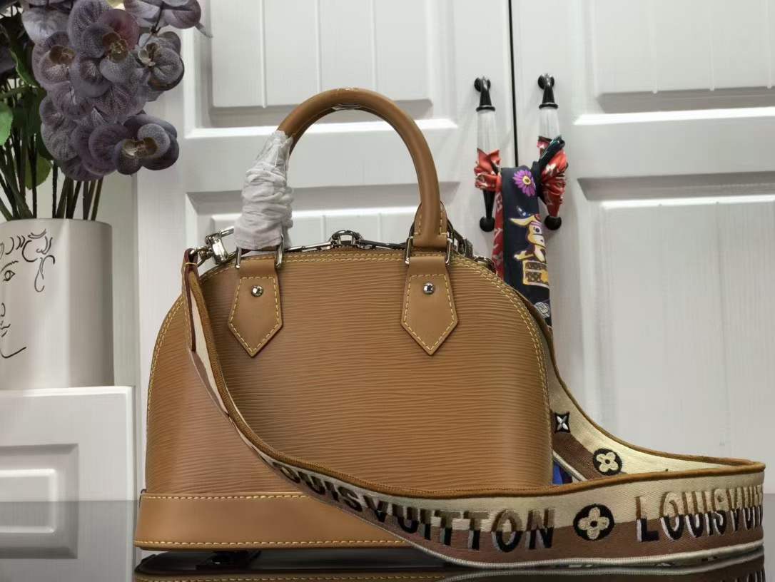 Louis Vuitton Alma Epi Gold Honey With Jacquard Strap 21 Louisvuitton 006 459 00 Atelier Elegant